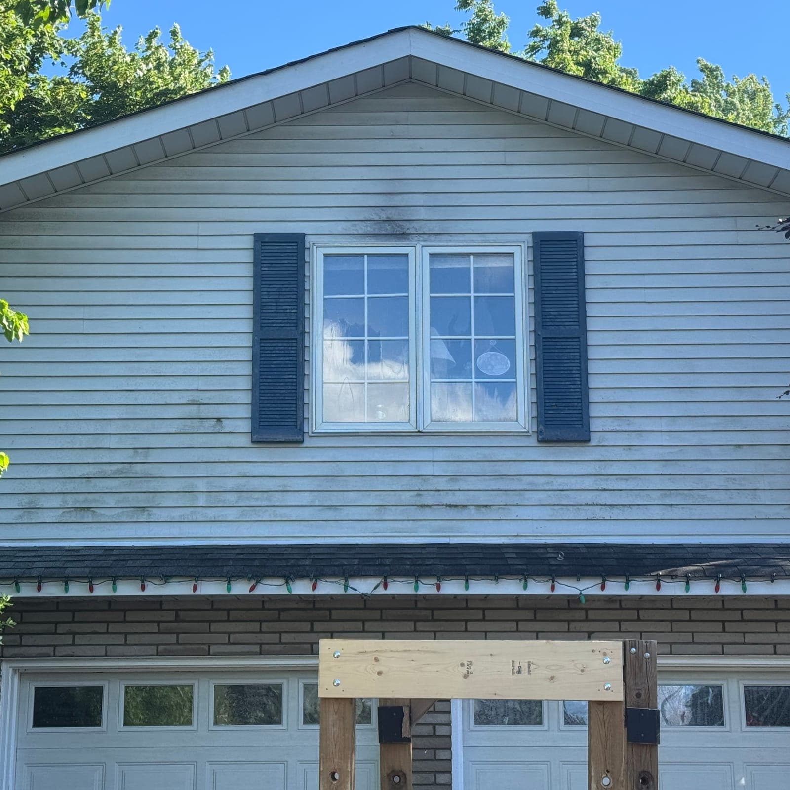 Before — Streaked siding, bright again